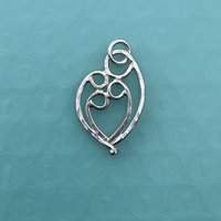 Mother & 3 child pendant, sterling silver.