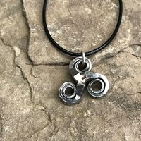 horseshoe nail triskelion necklace