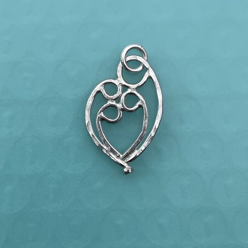 Mother & 3 child pendant, sterling silver.