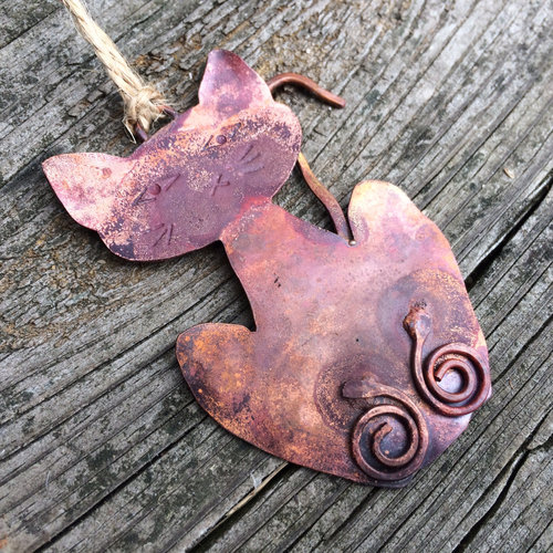 Copper cat ornament.