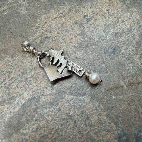 Freeform, Organic Sterling Necklace, tilted to left view.