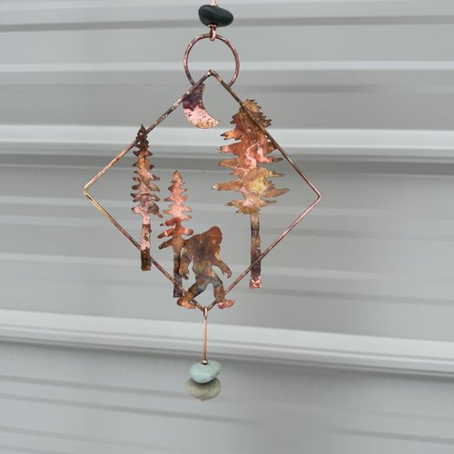 Sasquatch in forest copper mobile hanging