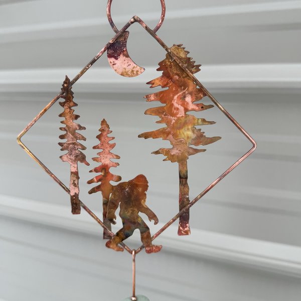 Sasquatch in forest copper mobile hanging
