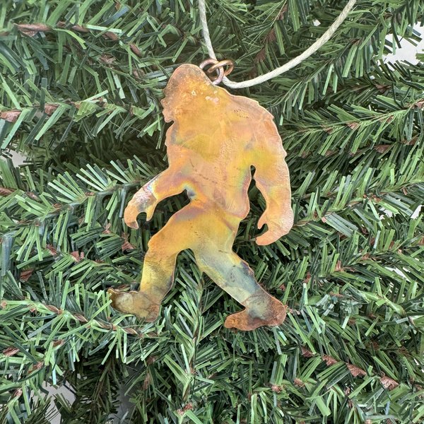 Copper Bigfoot ornament on tree